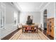 Stylish home office featuring a trey ceiling, custom shelving, and plenty of natural light at 3924 Overcup Oak Ln, Cary, NC 27519