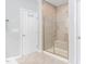 Modern bathroom featuring a tiled walk-in shower with a built-in bench at 3924 Overcup Oak Ln, Cary, NC 27519