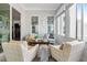Cozy sunroom with ample natural light, stylish seating, and a peaceful ambiance for relaxation at 3924 Overcup Oak Ln, Cary, NC 27519