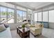 Inviting sunroom with comfortable seating and large windows offering scenic neighborhood views at 3924 Overcup Oak Ln, Cary, NC 27519