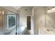 This bathroom features double sinks, a tub, and a separate shower, offering a luxurious and functional space at 4 Strowd Ct, Durham, NC 27703