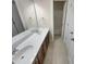 Bathroom featuring double sinks with a large mirror and a tiled floor at 4 Strowd Ct, Durham, NC 27703