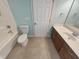 A functional bathroom with a tub, toilet, vanity, and tile floors at 4 Strowd Ct, Durham, NC 27703