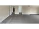 A carpeted bonus room with multiple doorways, ready for customization at 4 Strowd Ct, Durham, NC 27703