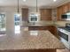 Spacious kitchen with granite counters, stainless steel appliances and hardwood floors, perfect for cooking and entertaining at 4 Strowd Ct, Durham, NC 27703