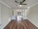 A bright living room with hardwood floors and a view to the dining area at 4 Strowd Ct, Durham, NC 27703