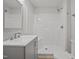 Bathroom with tiled shower, new sink, and toilet at 408 Charlotte Ave, Sanford, NC 27330
