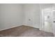 Clean bedroom with neutral carpet, closet and ample natural light at 408 Charlotte Ave, Sanford, NC 27330