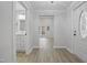 Bright entryway showcasing new floors and a glimpse into the bathroom and living spaces at 408 Charlotte Ave, Sanford, NC 27330