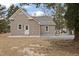 Exterior view of the home showcasing fresh exterior and a gravel driveway at 408 Charlotte Ave, Sanford, NC 27330