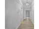 Hallway featuring new floors and a glimpse into the front door at 408 Charlotte Ave, Sanford, NC 27330