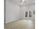 Spacious living room with vaulted ceilings, large windows, and modern flooring at 408 Charlotte Ave, Sanford, NC 27330