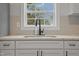 Kitchen sink featuring granite countertops, new faucet fixture, and a window view at 408 Charlotte Ave, Sanford, NC 27330