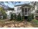 A charming home featuring a screened porch and wooden deck, complemented by a well-maintained backyard at 500 Chandler Grant Dr, Cary, NC 27519