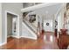 Inviting foyer with hardwood floors, staircase, and a view of the front door, setting a grand entrance at 500 Chandler Grant Dr, Cary, NC 27519
