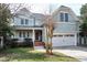 Charming two-story home with a welcoming front porch and a well-maintained lawn, perfect for curb appeal at 500 Chandler Grant Dr, Cary, NC 27519