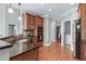 Functional kitchen with wooden cabinets, granite countertops, and modern appliances for cooking convenience at 500 Chandler Grant Dr, Cary, NC 27519