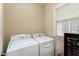 Practical laundry room with a washer, dryer, and natural light at 500 Chandler Grant Dr, Cary, NC 27519