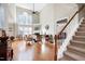 Bright, spacious living room with high ceilings, hardwood floors, fireplace, and natural light from large windows at 500 Chandler Grant Dr, Cary, NC 27519