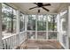 Relaxing screened-in porch with a ceiling fan and views of the backyard at 500 Chandler Grant Dr, Cary, NC 27519
