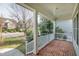 Charming front porch with brick flooring, white railings, and inviting curb appeal at 500 Chandler Grant Dr, Cary, NC 27519