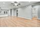 Open-concept living space featuring hardwood floors, neutral walls, and multiple entryways, ideal for entertaining at 507 W Edwards St, Princeton, NC 27569