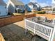 View of the backyard from the deck with chair, showing the wooden fence and fire pit at 5121 Windmere Chase Dr, Raleigh, NC 27616