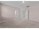 Spacious bedroom features neutral paint, plush carpeting, and access to a bathroom and walk-in closet at 5121 Windmere Chase Dr, Raleigh, NC 27616