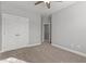 Spacious bedroom features neutral paint, plush carpeting, and a double door closet at 5121 Windmere Chase Dr, Raleigh, NC 27616