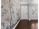 Entryway featuring dark hardwood floors and stylish floral wallpaper at 5121 Windmere Chase Dr, Raleigh, NC 27616