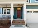 Inviting front entrance with a brick staircase, a red door, and a storm door at 5121 Windmere Chase Dr, Raleigh, NC 27616
