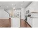 Spacious kitchen with stainless steel appliances, granite countertops, and hardwood floors at 5121 Windmere Chase Dr, Raleigh, NC 27616