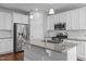 Bright kitchen with stainless steel appliances and a granite island at 5121 Windmere Chase Dr, Raleigh, NC 27616