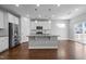 Stylish kitchen featuring stainless steel appliances, an island, and hardwood floors at 5121 Windmere Chase Dr, Raleigh, NC 27616