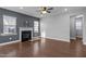 Living room featuring a fireplace with ample natural light and hardwood floors at 5121 Windmere Chase Dr, Raleigh, NC 27616