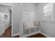 Mudroom with a built-in bench, coat hooks, storage cubbies, and natural light at 5121 Windmere Chase Dr, Raleigh, NC 27616