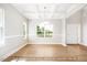 Elegant dining room featuring coffered ceilings, hardwood floors, and large windows at 5372 Salem Woods Dr # 18, Graham, NC 27253