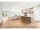 Modern kitchen with a large island, stainless steel appliances, and open to living area at 5372 Salem Woods Dr # 18, Graham, NC 27253