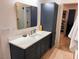 Bathroom featuring a large vanity, ample storage, and a walk-in closet nearby at 582 Harnett Central Rd, Fuquay Varina, NC 27526