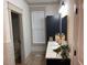 Modern bathroom with a sleek vanity, stylish lighting, and a window for natural light at 582 Harnett Central Rd, Fuquay Varina, NC 27526