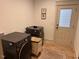 Functional laundry room with modern washer and dryer units, storage, and natural light at 582 Harnett Central Rd, Fuquay Varina, NC 27526