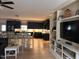 Open concept living room with built-ins, and adjacent dining area at 582 Harnett Central Rd, Fuquay Varina, NC 27526