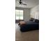 Comfortable main bedroom featuring a large window and neutral décor at 582 Harnett Central Rd, Fuquay Varina, NC 27526