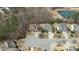 An aerial perspective highlights a neighborhood layout with ponds, trees, and well-kept lawns at 6205 Roles Saddle Dr, Rolesville, NC 27571