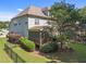 Back exterior view of a house with a screened deck and fenced in yard at 6205 Roles Saddle Dr, Rolesville, NC 27571