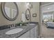 Bathroom featuring double sinks, granite countertops, and lots of vanity space at 6205 Roles Saddle Dr, Rolesville, NC 27571