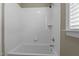 Bathroom with a bathtub, shower combo with white subway tile at 6205 Roles Saddle Dr, Rolesville, NC 27571