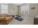 Relaxing bedroom featuring comfortable chair and natural light at 6205 Roles Saddle Dr, Rolesville, NC 27571