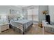 This bedroom features soothing wall colors and furnishings, with natural light through the window at 6205 Roles Saddle Dr, Rolesville, NC 27571