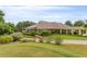 A beautiful clubhouse with well-maintained landscaping and covered patio at 6205 Roles Saddle Dr, Rolesville, NC 27571